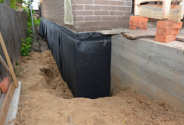 SJ Waterproofing Pros technician performing targeted Wet Basement Repair assessment in Risingsun, OH
